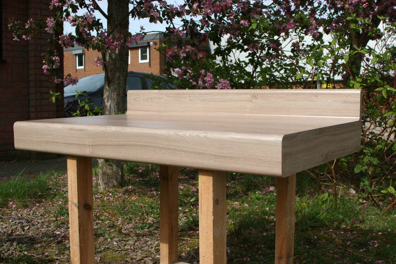 Postforming light oak vanity top with box edges.